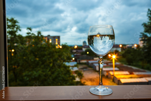 glass of wine on a background of vineyard