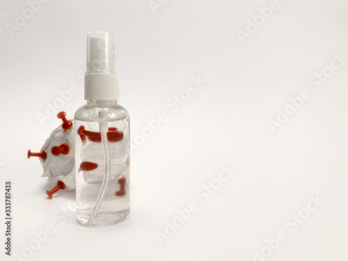 coronavirus and antiseptic. Transparent bottle with antiseptic spray and coronavirus. antiseptic spray before coronavirus. medical education coronavirus and antiseptic. background for medical banner.