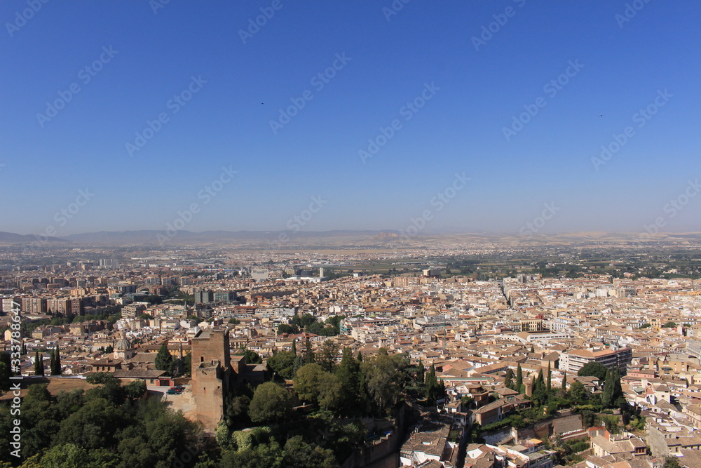 Aerial view of the Albaicin city taken from Watch Tower (Torre de la Vela) of the historical Alhambra Palace complex in Granada, Andalusia, Spain.
