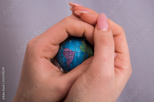 Wallpaper Mural A little globe in women 's hands Torontodigital.ca