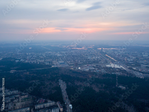 Sunset over Kiev and the Dnieper River, view from the left bank. Aerial drone view.