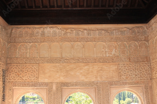 Historical wall carvings inside Generalife Palace at Alhambra palace and fortress complex in Granada, Andalusia, Spain. photo