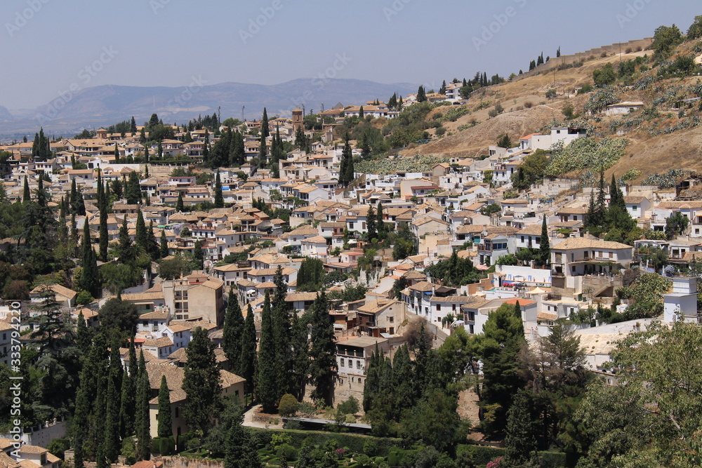 Aerial view of the Albaicin city taken from Generalife Gardens of the historical Alhambra Palace complex in Granada, Andalusia, Spain.
