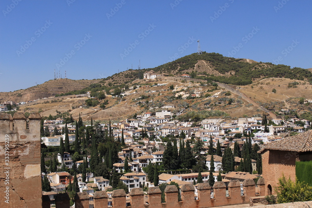 Aerial view of the Albaicin city taken from Nasrid Palaces of the historical Alhambra Palace complex in Granada, Andalusia, Spain.