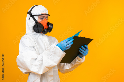 Epidemiologist in a respirator. Respirator on the face of a viro