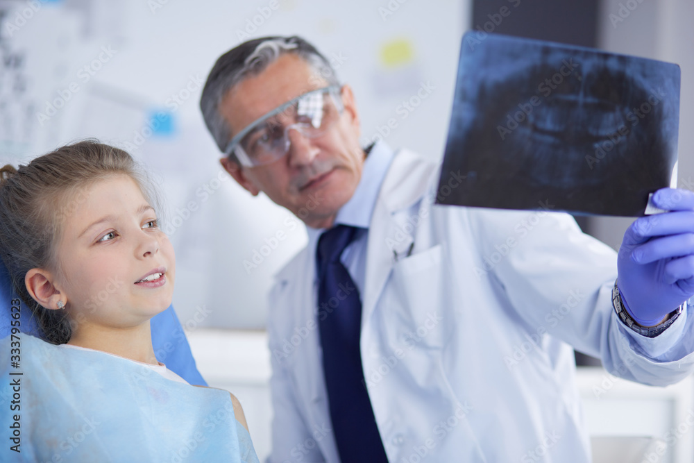 Little girl sitting in the dentists office Little girl sitting in the dentists office