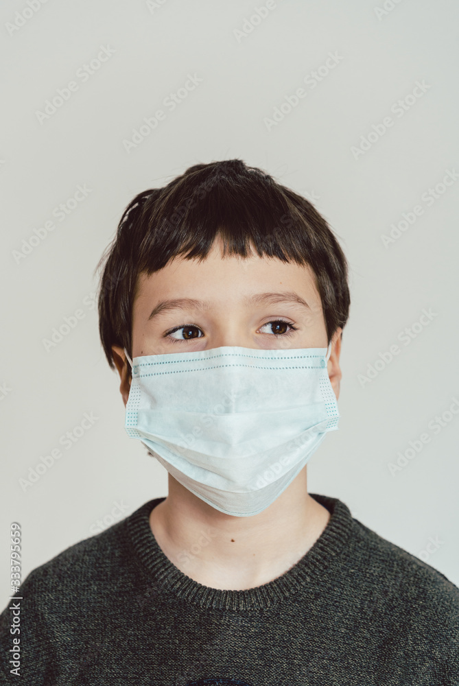 Young boy wearing fact mask during Covid-19 crisis Young boy wearing fact mask during Covid-19 crisis