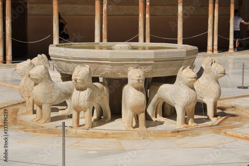 The marble fountain of Patio of the Lions (Patio de los Leones) at Nasrid Palaces (Palacios Nazaries) at Alhambra Palace and fortress complex in Granada, Andalusia, Spain.