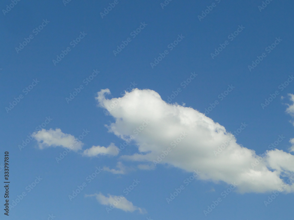 A blue sky with clouds forming an elephant A blue sky with clouds forming an elephant