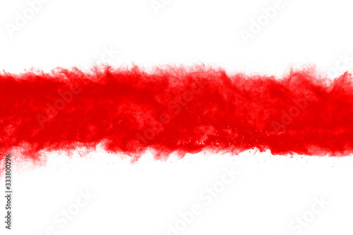 Freeze motion of red powder exploding, isolated on white background. Abstract design of red dust cloud. Particles explosion screen saver, wallpaper