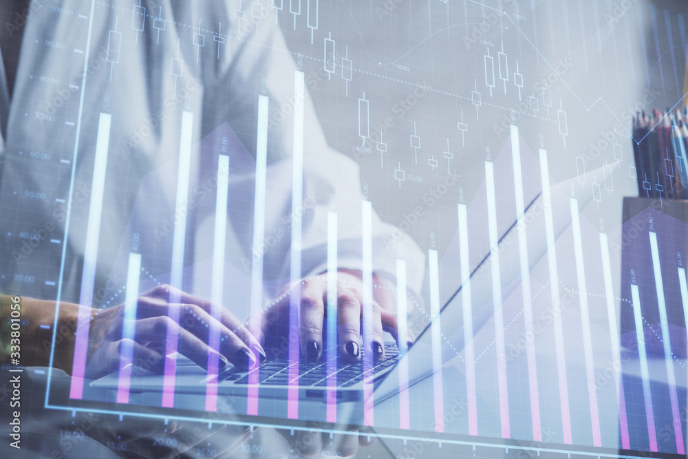 Double exposure of woman hands typing on computer and forex chart hologram drawing. Stock market invest concept. Double exposure of woman hands typing on computer and forex chart hologram drawing. Stock market invest concept.