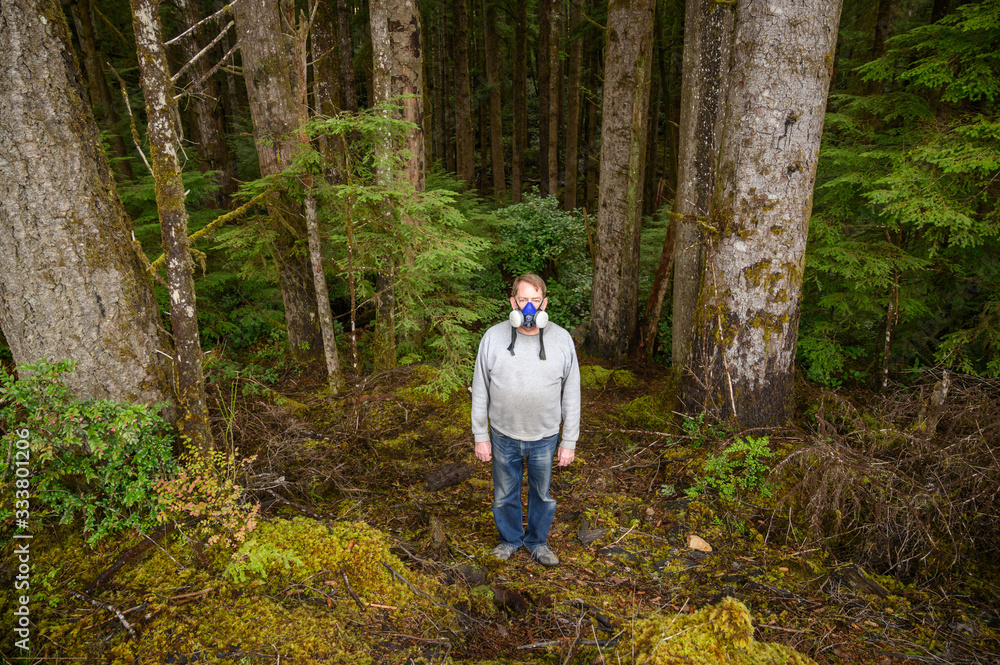 Man wears N95 mask in forest to protect him from coronavirus 