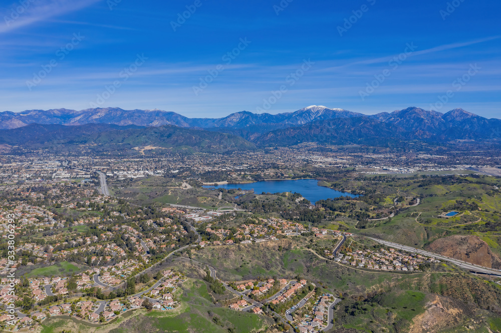 Aerial view of Puddingstone Reservoir with Mt. Baldy as background