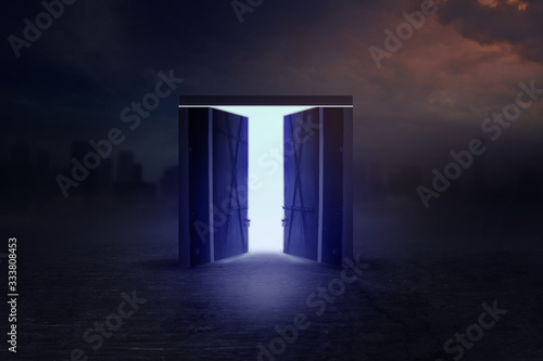 Fotografie Open wooden door to the new world with green environment