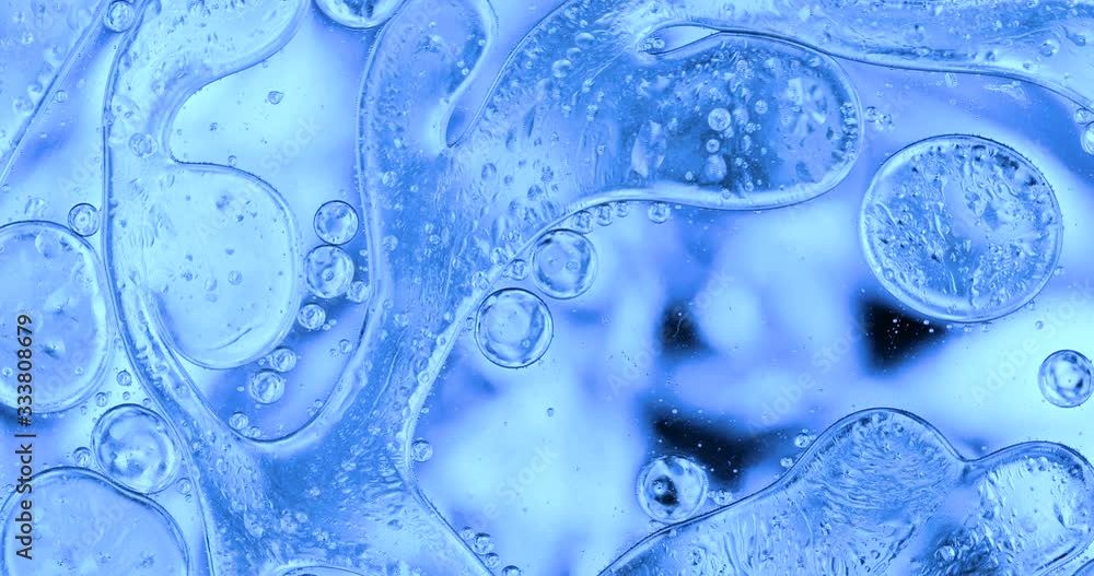 Movement oxygen bubbles in a liquid. Beautiful structure of water in macro a natural background Movement oxygen bubbles in a liquid. Beautiful structure of water in macro a natural background
