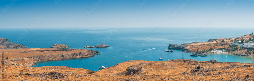 Beautiful beach panorama and the historic city of Lindos.