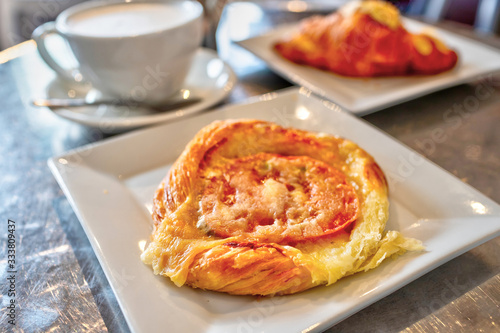 Tomato tart puff pastry topped with cheese