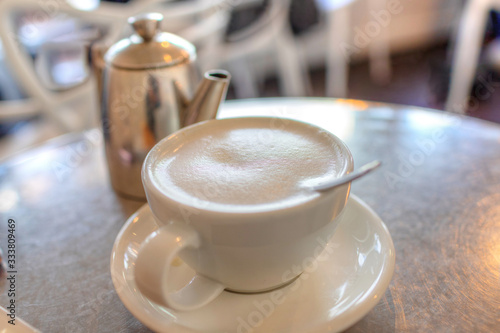 Canvas Print Focus on hot London Fog tea latte drink with foamed milk