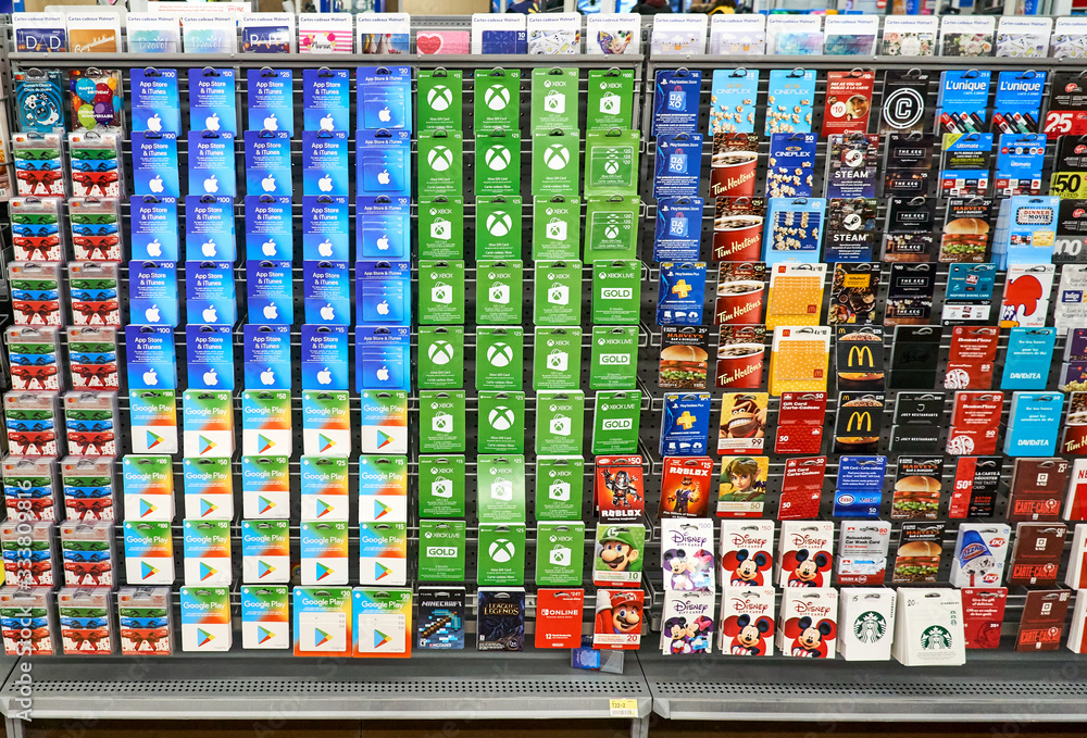 A stand with gift cards of Apple Store, McDonalds, Xbox, Nintendo, iTunes,  Visa, Playstation, Google Play, Minecraft Stock Photo | Adobe Stock