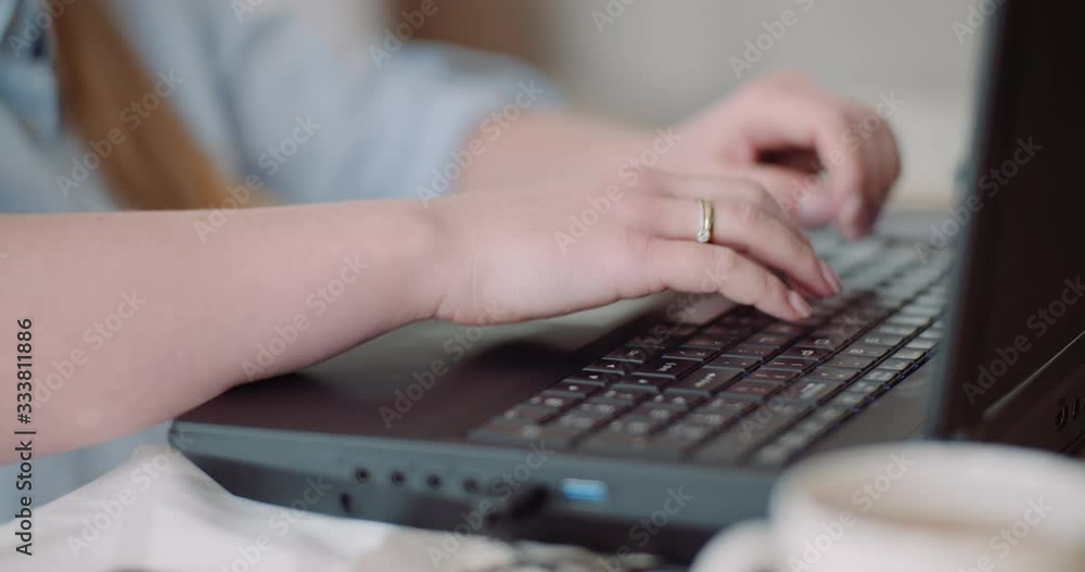 Young Businesswoman typing response to client email. Woman typing on Keyboard. Young Businesswoman typing response to client email. Woman typing on Keyboard.