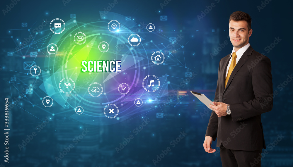 Businessman thinking in front of technology related icons and SCIENCE inscription, modern technology concept Businessman thinking in front of technology related icons and SCIENCE inscription, modern technology concept