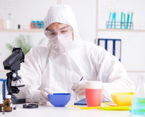 Chemist checking and testing plastic dishes