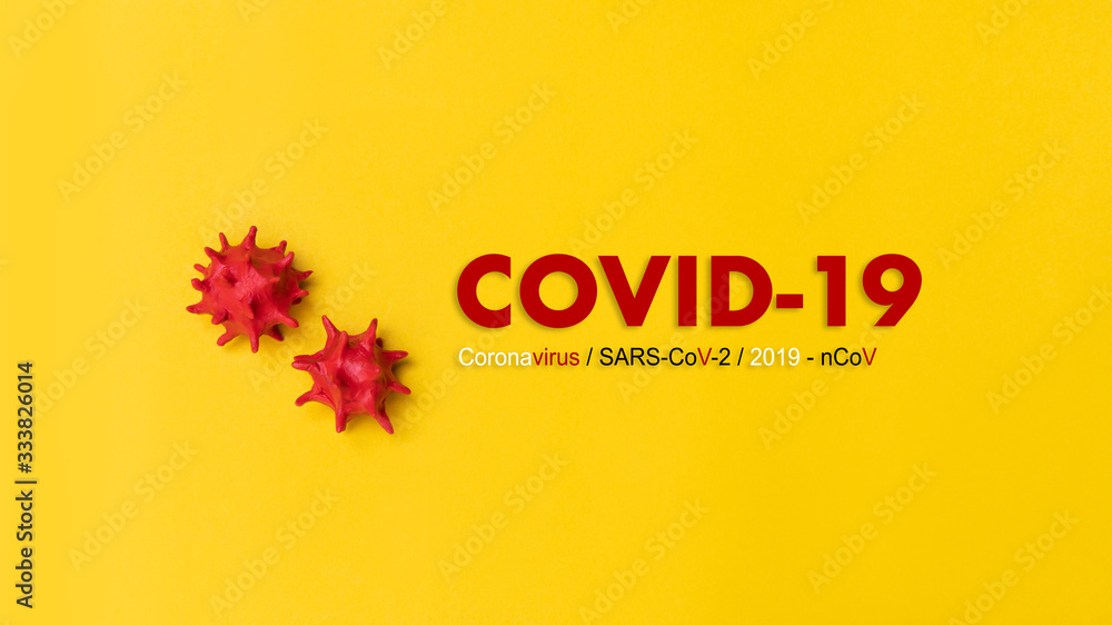Inscription COVID-19 or Coronavirus on yellow background. World Health Organization WHO official name SARS-CoV-2