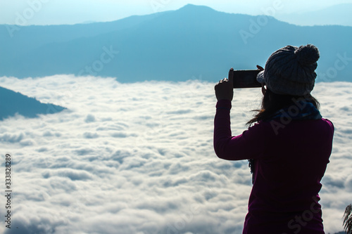 silhouette of photographer on top mountain