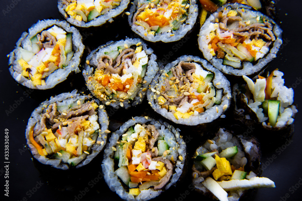 Korean food, wraping rice with seaweed and filled with vegetables and beef Korean food, wraping rice with seaweed and filled with vegetables and beef