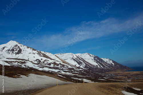 Amazing winter landscape of the snow cap on the mountain range in Iceland © Tazzjang