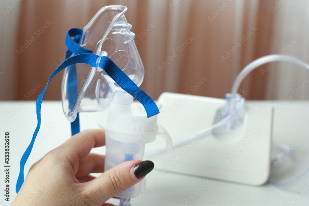 Medical equipment for inhalation with respiratory mask, nebulizer. Asthma breathing treatment. Bronchitis, asthmatic health equipment. Medical equipment for inhalation with respiratory mask, nebulizer. Asthma breathing treatment. Bronchitis, asthmatic health equipment.