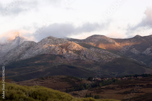 Landscape of mountains with small village in a cloudy day © Mikel Lera