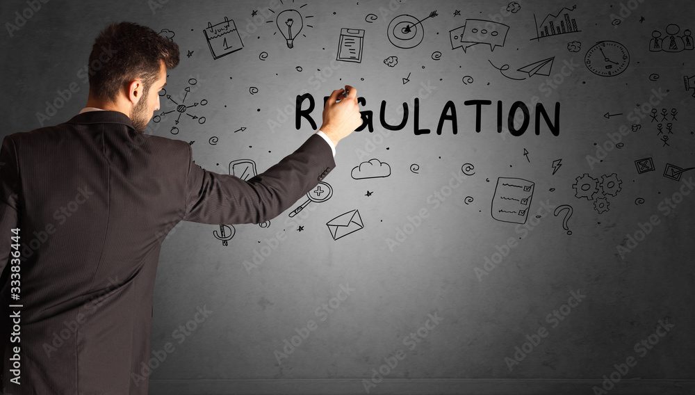 businessman drawing a creative idea sketch with REGULATION inscription, business strategy concept businessman drawing a creative idea sketch with REGULATION inscription, business strategy concept