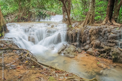 view of silky waterfall around with green forest background  Kroeng Krawia Waterfall  Sangkhla Buri  Kanchanaburi  west of Thailand.