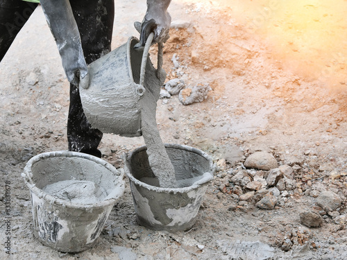 pouring cement in bucket