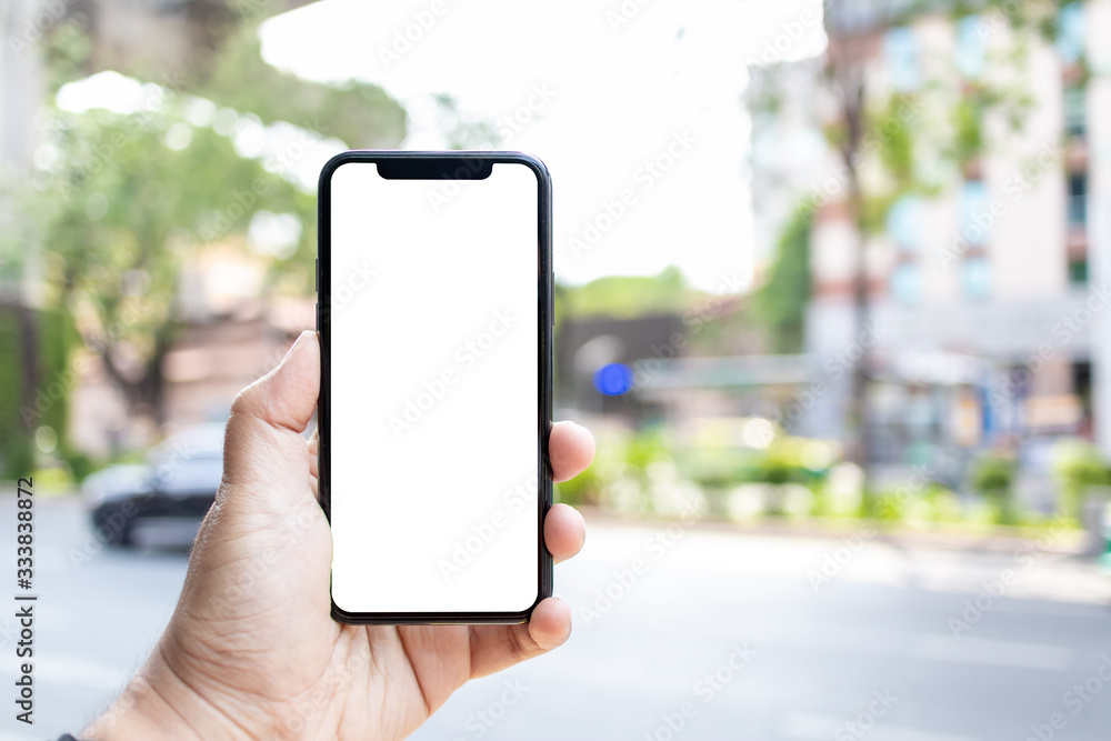 Asian man holding phone mock up left frame at street outdoor have environment city and tree background
isolated display for insert screen Asian man holding phone mock up left frame at street outdoor have environment city and tree background
isolated display for insert screen