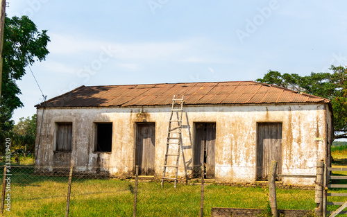 Old abandoned house of European architecture in the interior of the State of RS in Brazil photo