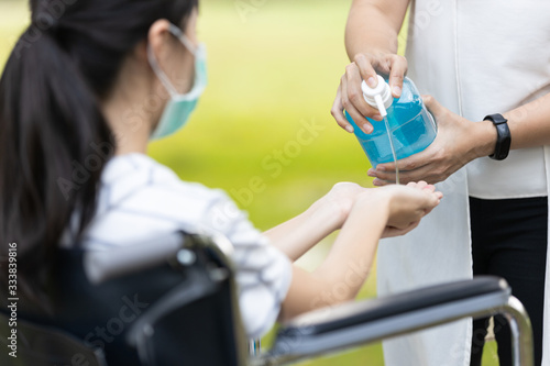 Asian child girl using alcohol antiseptic gel prevention cleaning hands frequently prevent infection outbreak of Covid-19 woman wash hands with hand sanitizer to avoid contamination with Coronavirus