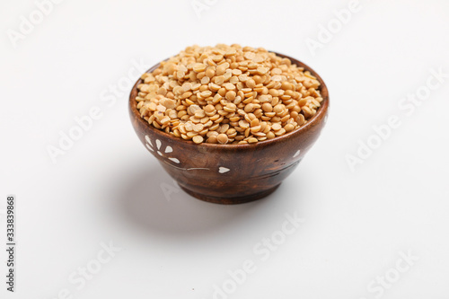 pigeon pea also known as toor dal in wooden bowl.
