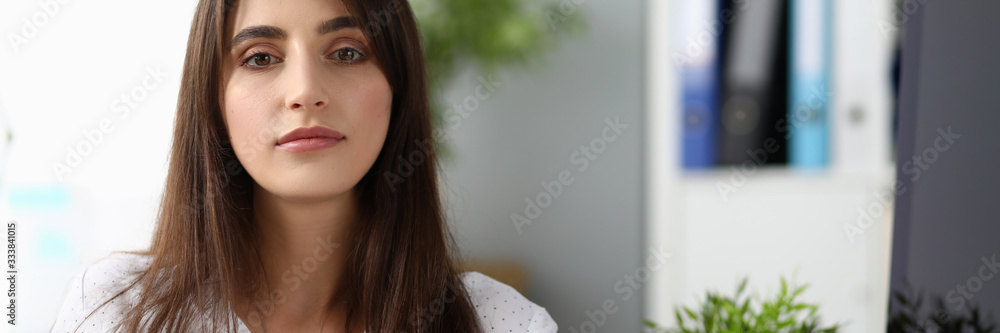 Portrait of beautiful businesswoman wearing strict white blouse. Wonderful lady working in international designer company. Business and art design concept. Blurred background Portrait of beautiful businesswoman wearing strict white blouse. Wonderful lady working in international designer company. Business and art design concept. Blurred background