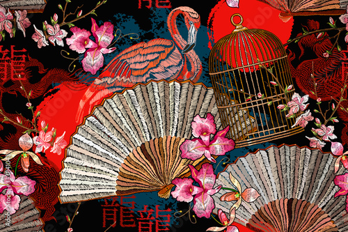 Asian seamless pattern. Pink flamingo, japan fan, rising red sun, golden cage and sakura flowers. Hieroglyph dragon. Fashion oriental art. Japanese and Chinese style