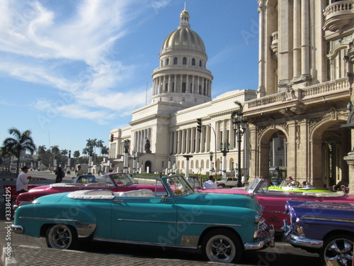 Havana,Cuba - January 24, 2020 : American convertible vintage cars parked on the main street in Havana Cuba. © georgidimitrov70