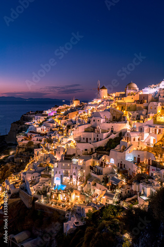 Impressive evening view of Santorini island. Picturesque spring sunset on the famous Greek resort Oia, Greece, Europe. Traveling concept background. Artistic style post processed photo.