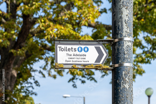 A sign giving directions to a member of community toilet scheme in teddington, london, England photo