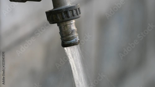 Outdoor tap water. Water is the most importent things on earth . All animals and plants need water to survive.  photo