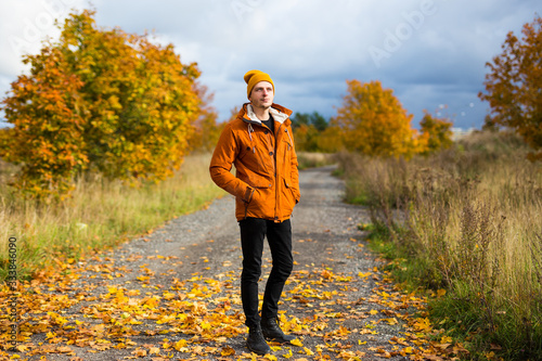 full length portrait of young man posing in autumn park © Di Studio