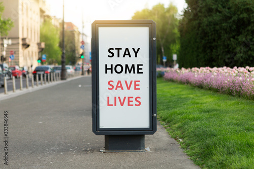 Street banner with the inscription "Stay home save lives". Quarantine self-isolation