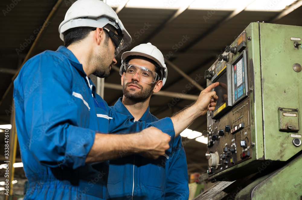 Industrial workers are working on projects in large industrial plants with many devices. Industrial workers are working on projects in large industrial plants with many devices.