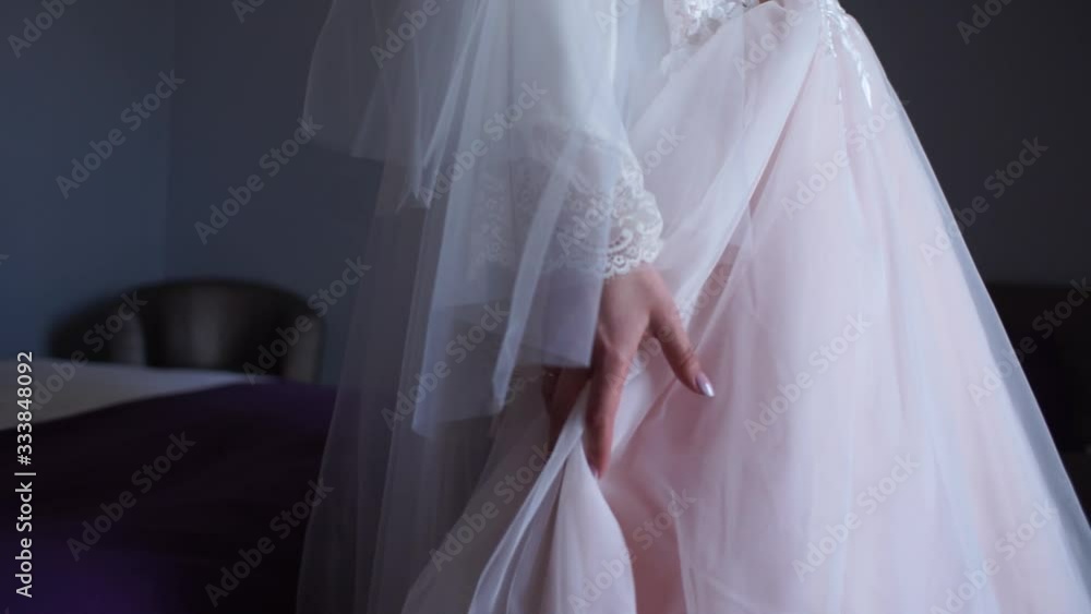 hand of the bride on a wedding dress hand of the bride on a wedding dress