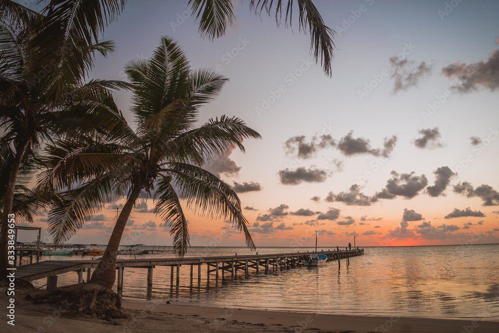 Fototapeta premium Sunrise San Pedro Belize Beach Pier Boat Central America